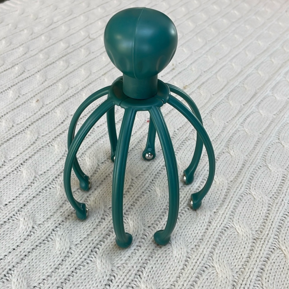 Scalp massager gently massages pressure points and sensitive nerves on head/neck